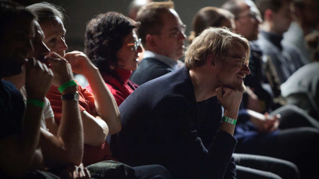 Row of people sitting and looking forward