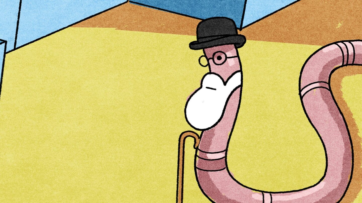 A digital illustration of an earthworm within a yellow room with blue walls. It has a black bowler hat, glasses, a white beard, and holds a walking cane despite not having visible arms. It appears to have a neutral expression and looks to the left side of the image.
