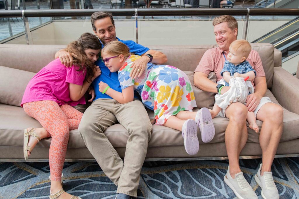Two parents of children with the MED13L genetic mutation at a conference hosted by Simons Searchlight.
