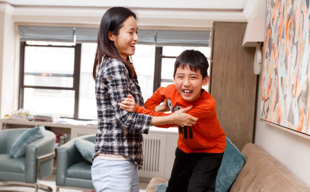 Image of boy playing with adult