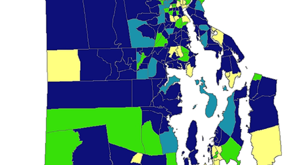 A color-coded map of Rhode Island divided into cities and towns, shaded in dark blue, yellow, green, and teal, with no labels or legend visible.