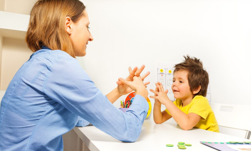 Image of clinician assessing behavioral and motor skills in a young child.