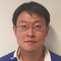 Headshot of SFARI Investigator Zhenglong Gu.