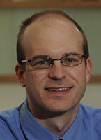 Headshot of SFARI Investigator Greg Cooper.