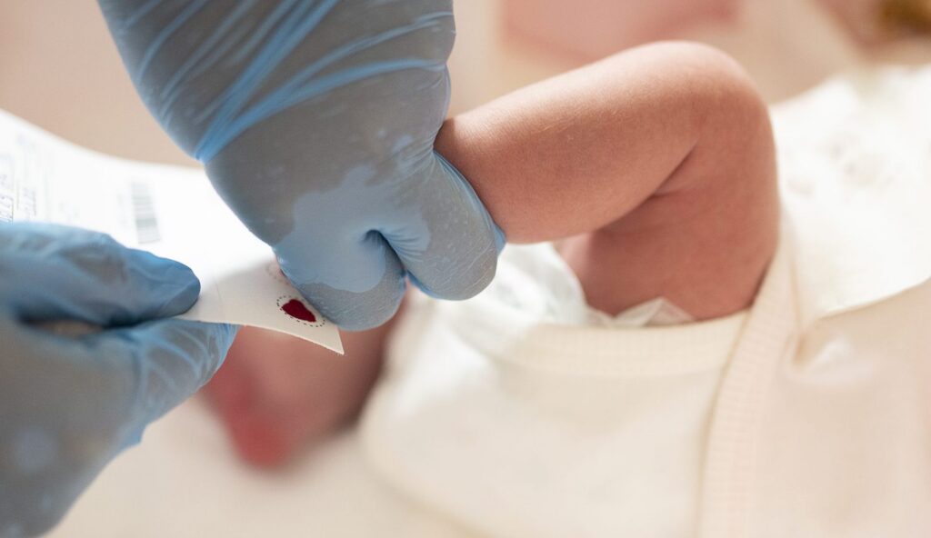 Image of baby getting blood taken
