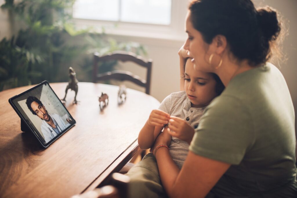 A woman and child getting a diagnosis via video chat