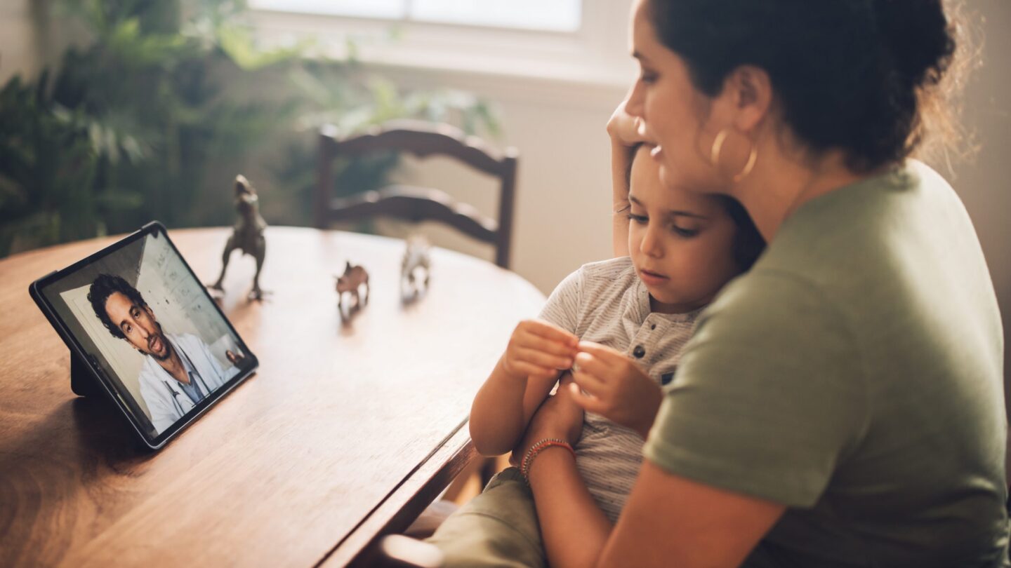 A woman and child getting a diagnosis via video chat