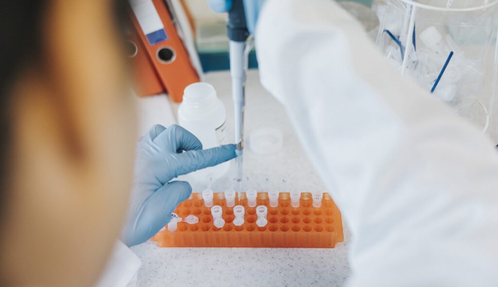 Scientist pipetting