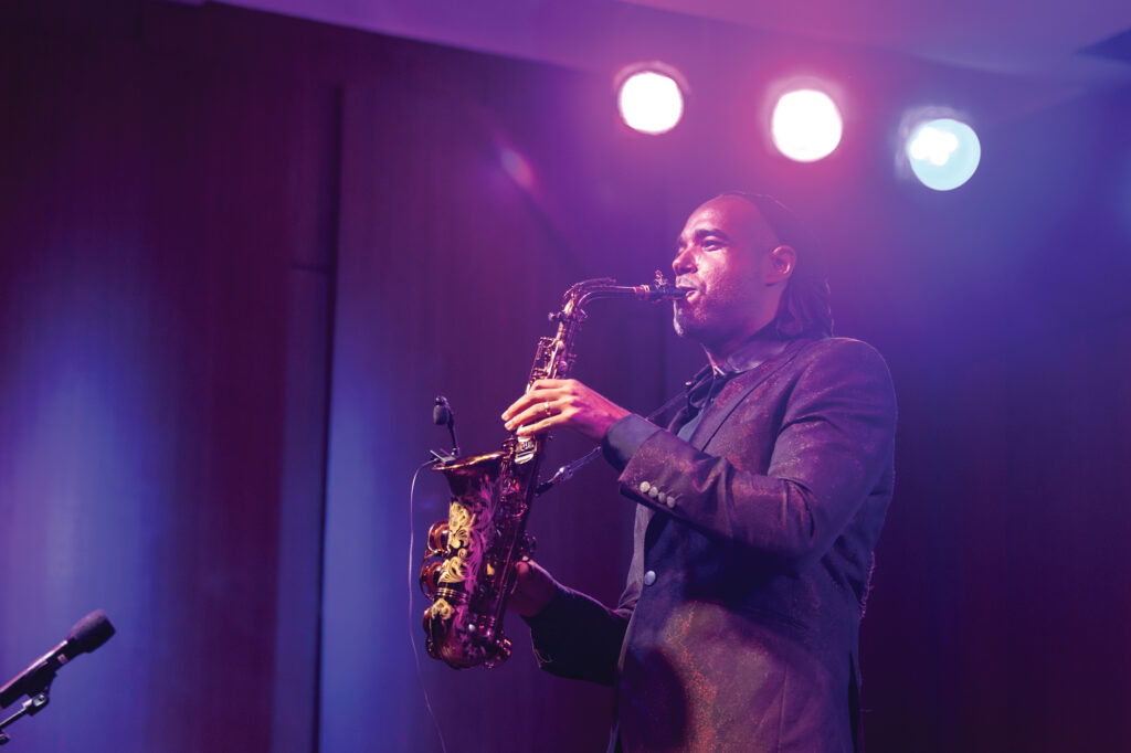 Photo of Marcus Garrick playing the saxophone.