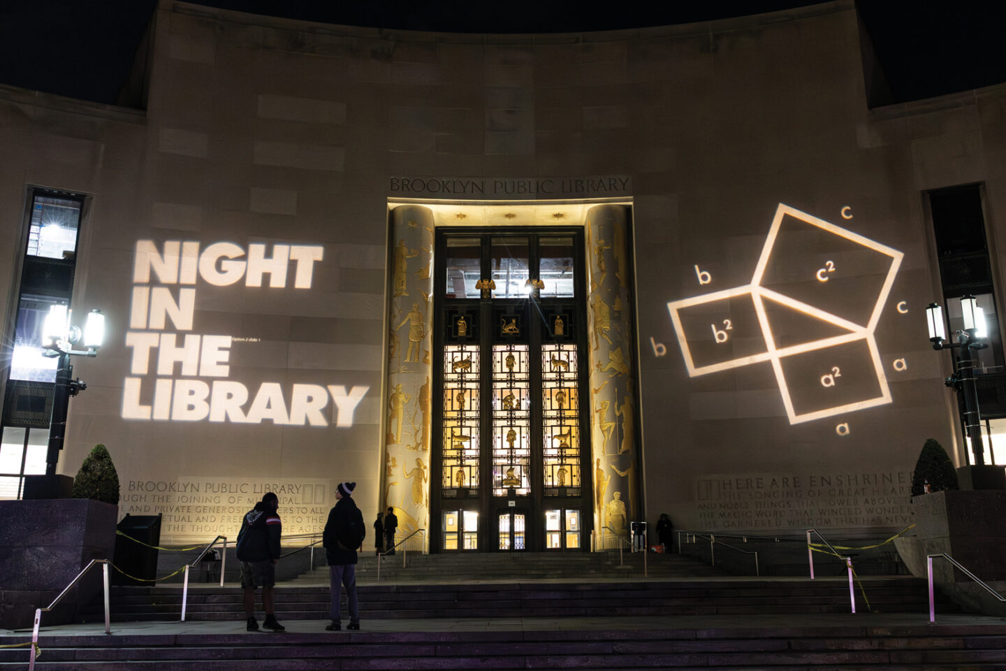 Photo of the entrance to the Brooklyn Public Library at night time.
