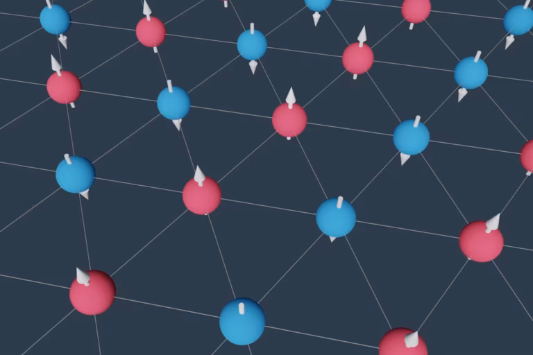 A grid of blue and pink spheres, each with a small white arrow pointed in various directions, representing a lattice structure with alternating colors.