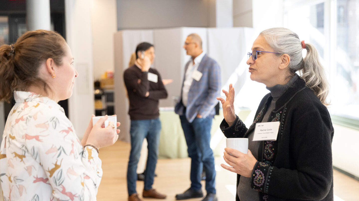People talking during the break during the Pivot meeting.