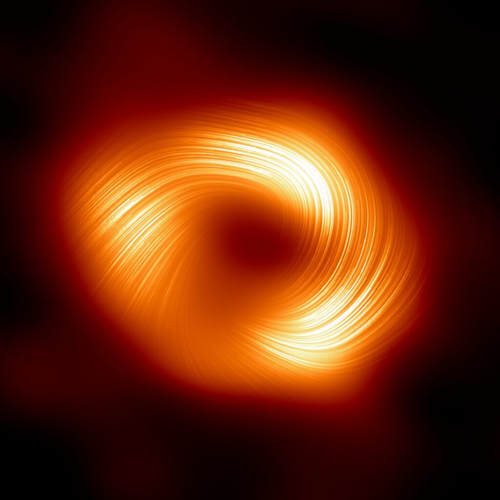 Glowing, swirling orange and yellow light forms a bright ring around a dark center against a black background, resembling an artistic depiction of a black hole.