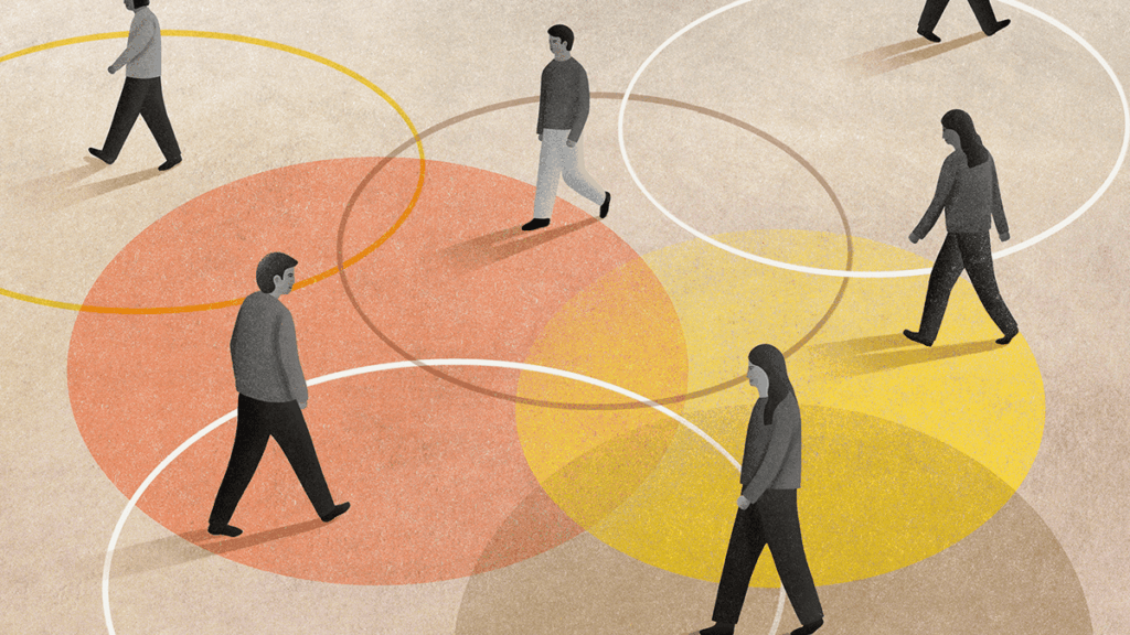 People walking within overlapping colored circles on the ground.
